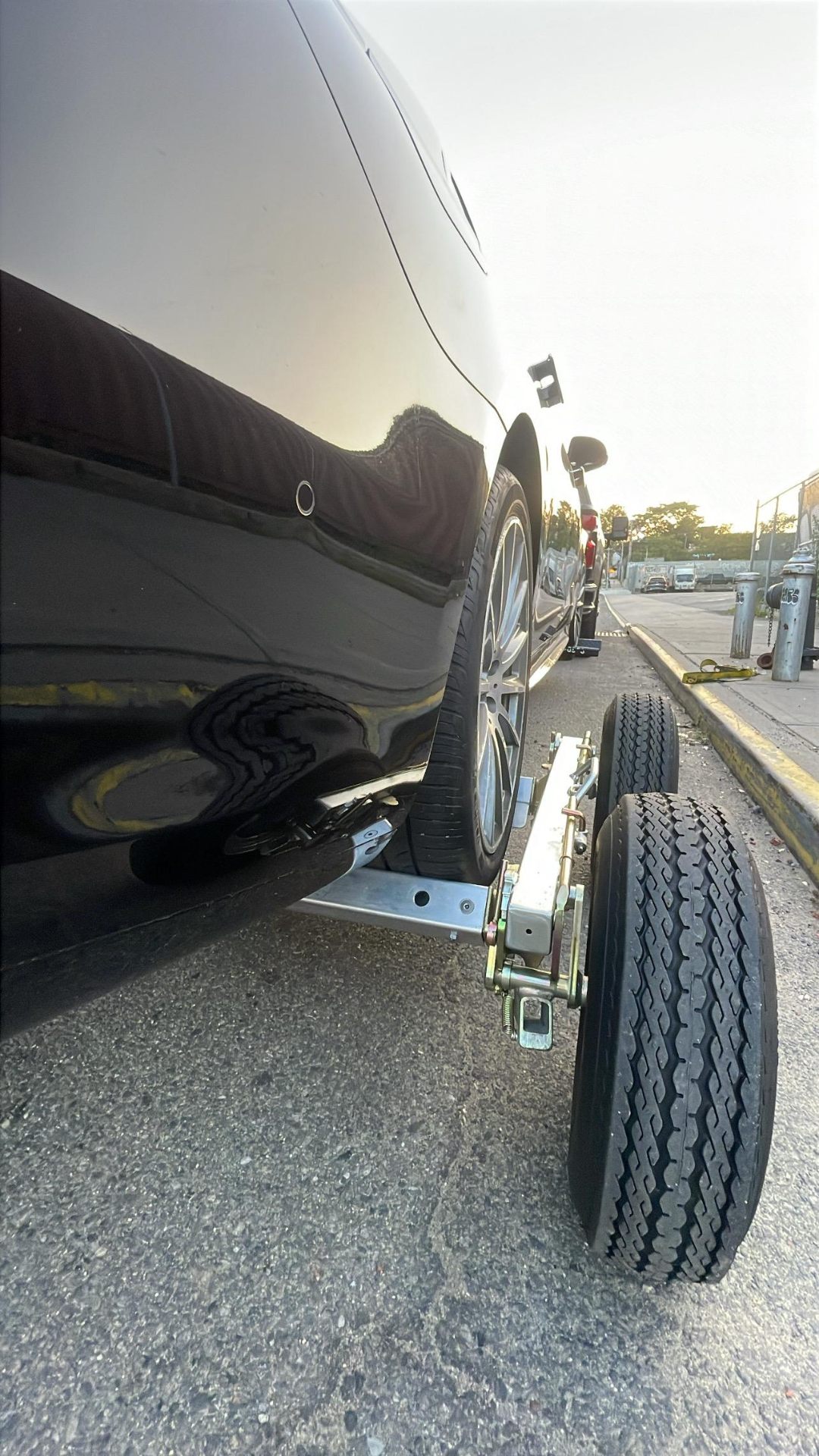 Car being loaded on tow truck dolly