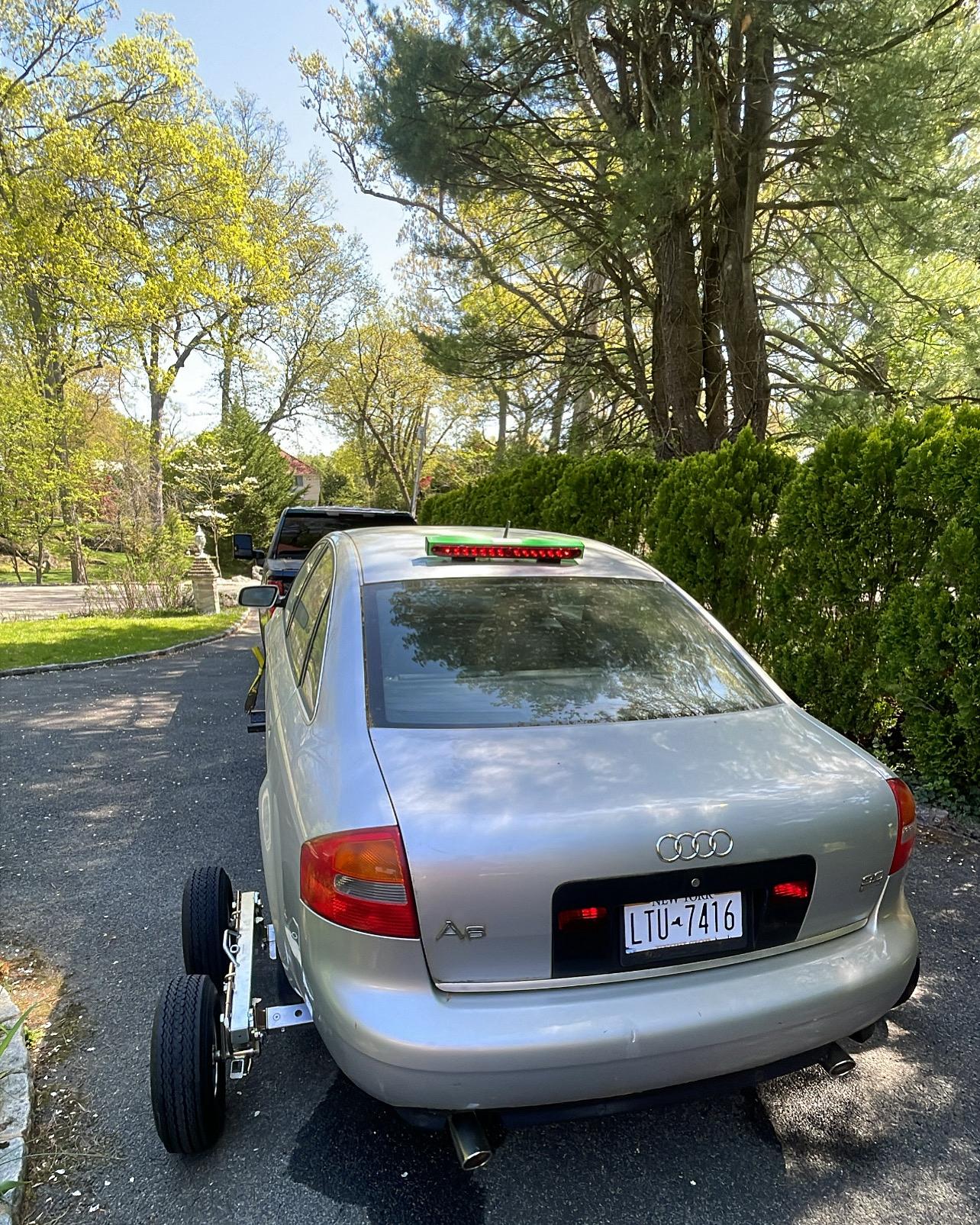 Audi A6 being towed with professional equipment